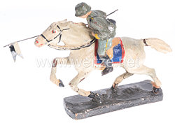 Heer Reiter mit Lanzenfahne im Anschlag auf Pferd im Galopp